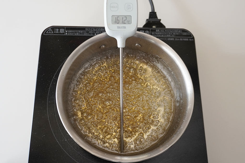 160～165°C